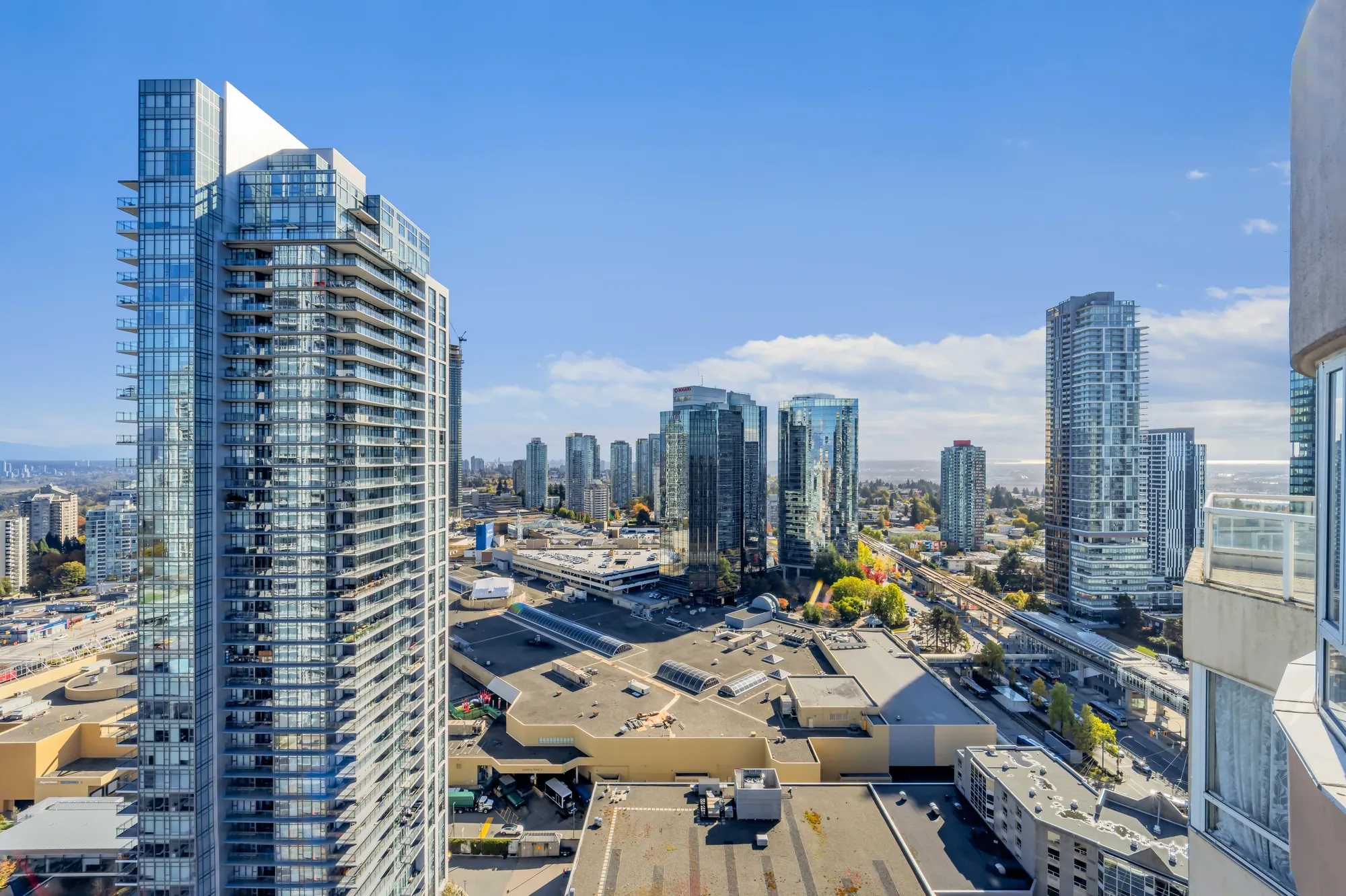 The view over the roof of the mall and the SkyTrain line to towers and the horizon