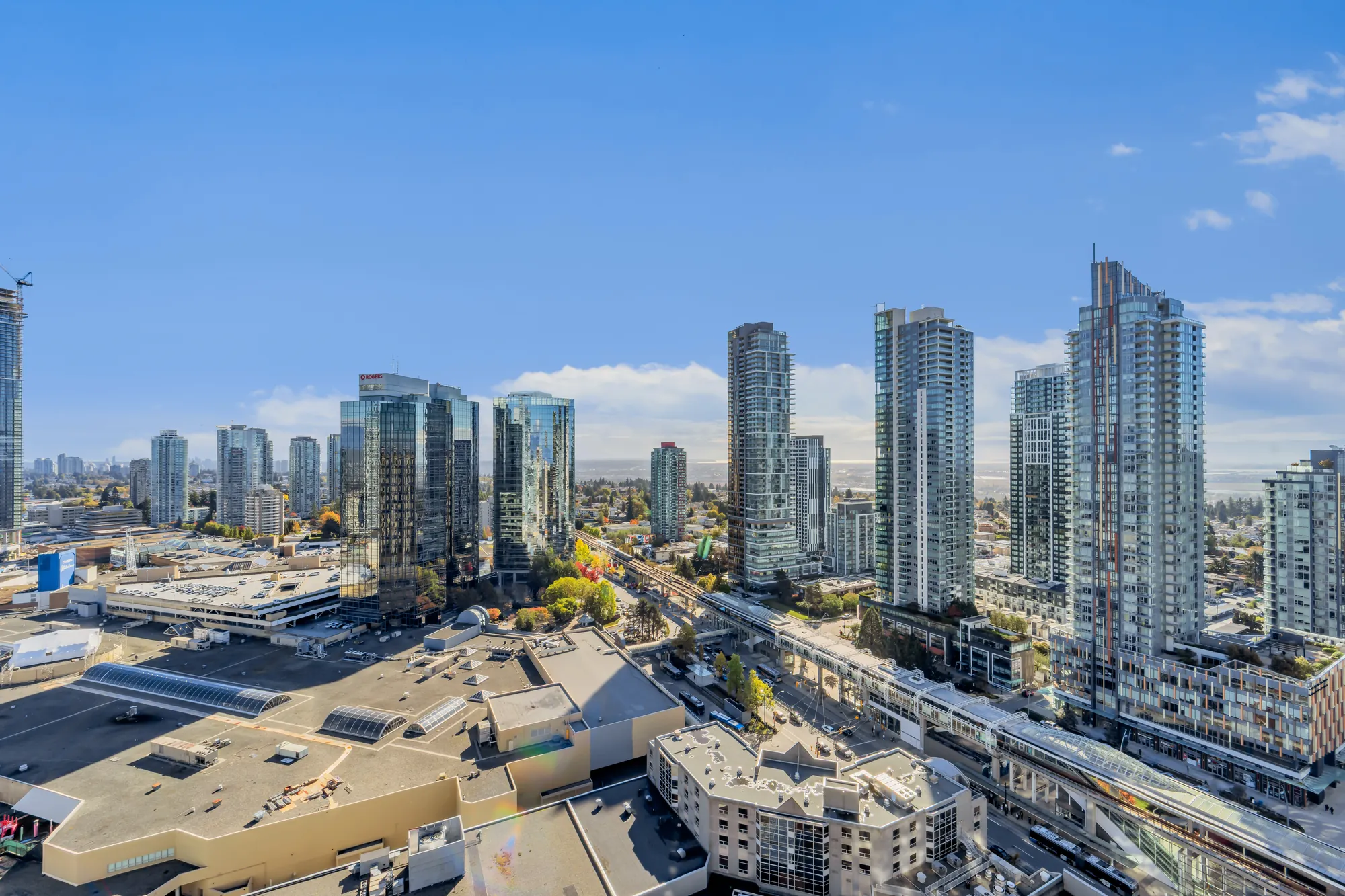 The towers of Metrotown, the mall roof and the SkyTrain guideway below